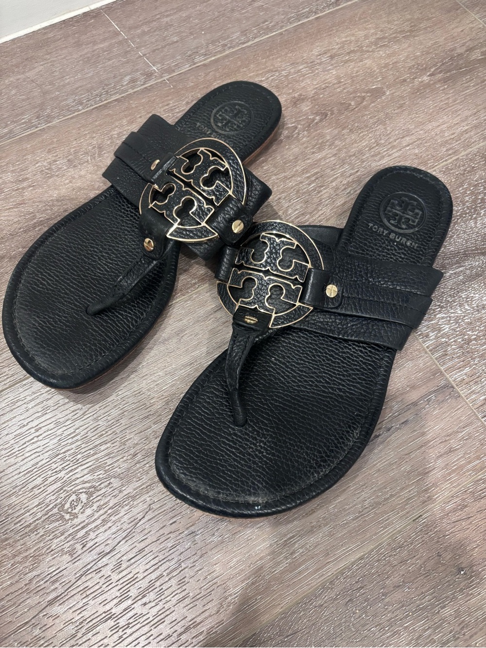 Tory Burch Black Leather Logo Thong Sandals with Gold Emblem